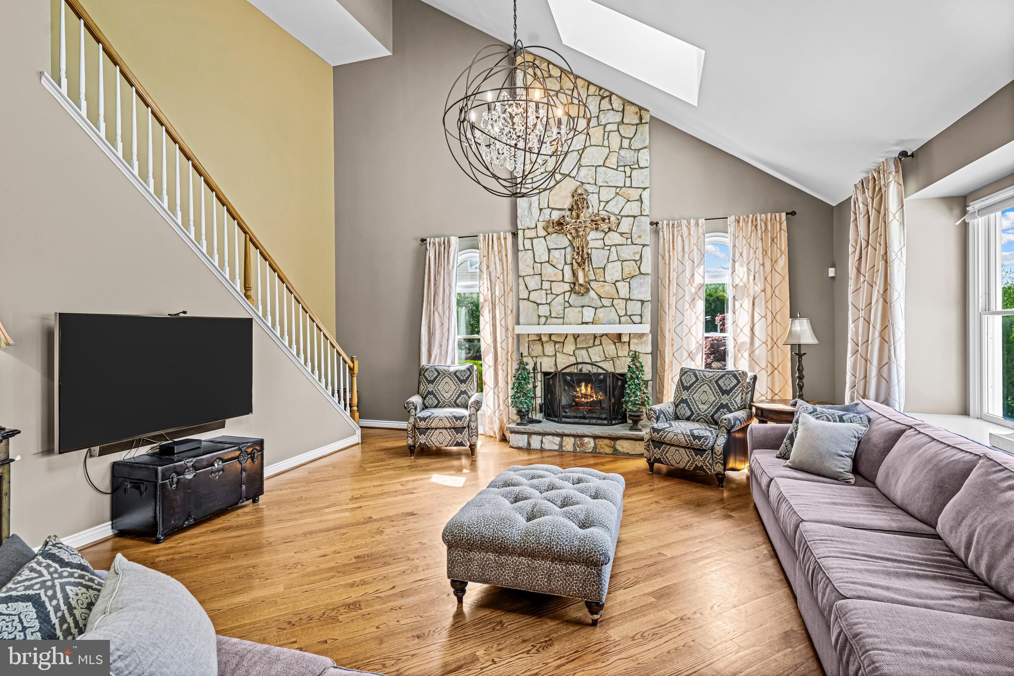 61 Brooks Road Moorestown, NJ 08057 - Photo 52 of 93 a living room with furniture a fireplace and a flat screen tv