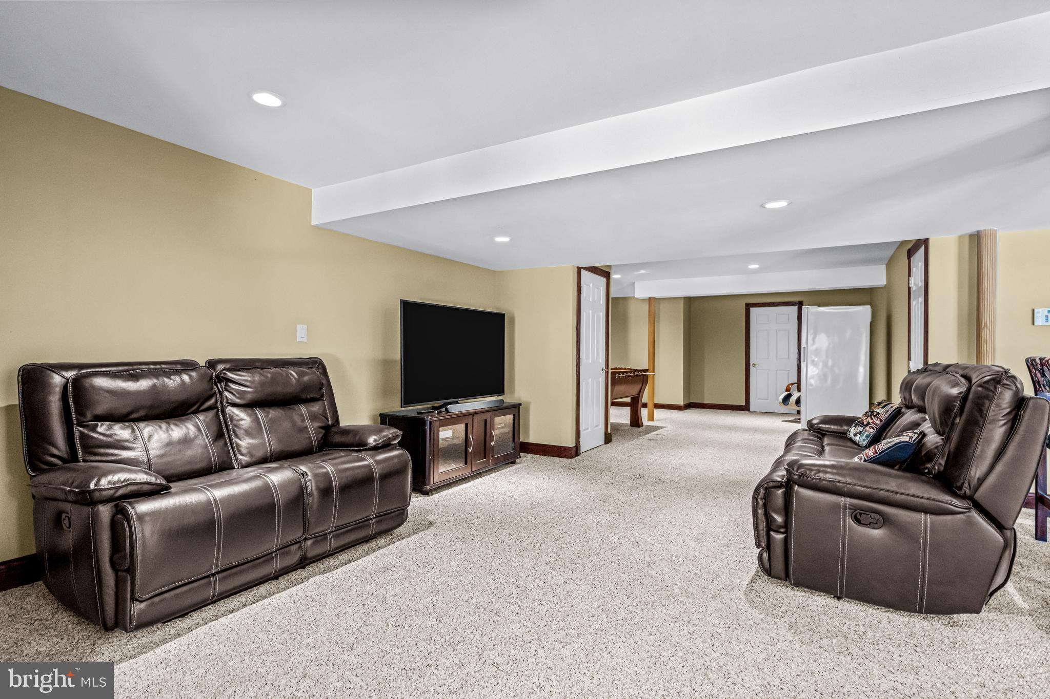61 Brooks Road Moorestown, NJ 08057 - Photo 72 of 93 a living room with furniture and a flat screen tv