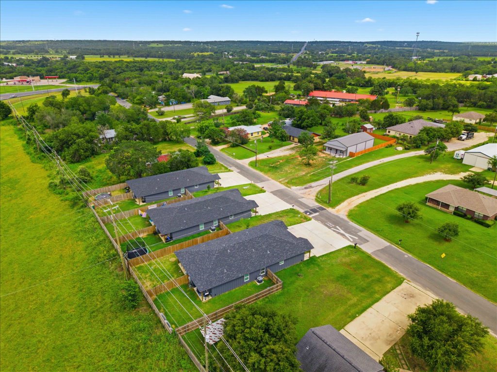 111 Fisher Street, Unit A & B Elgin, TX 78621 - Photo 3 of 13 an aerial view of a house with a garden
