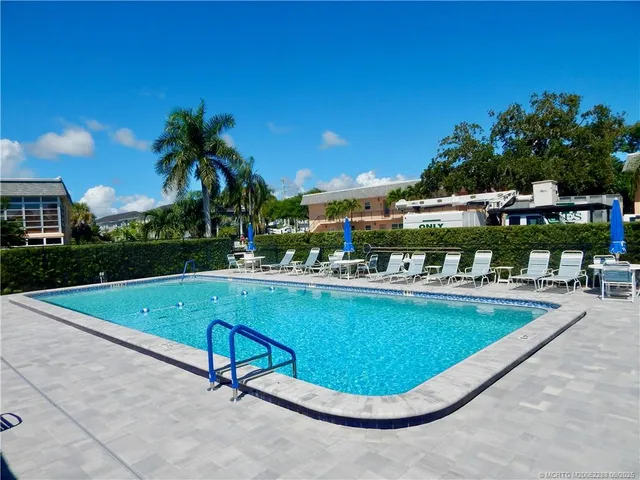 a view of a swimming pool with a patio