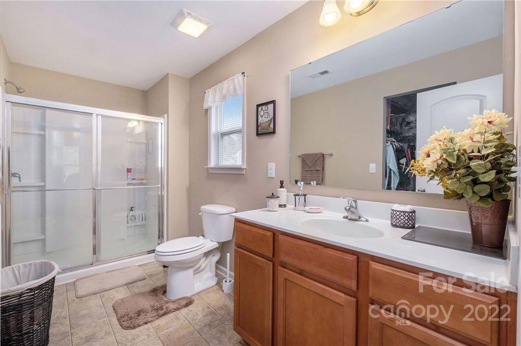 5846 Ringneck Road Charlotte, NC 28216 - Photo 17 of 28 a bathroom with a sink toilet and shower