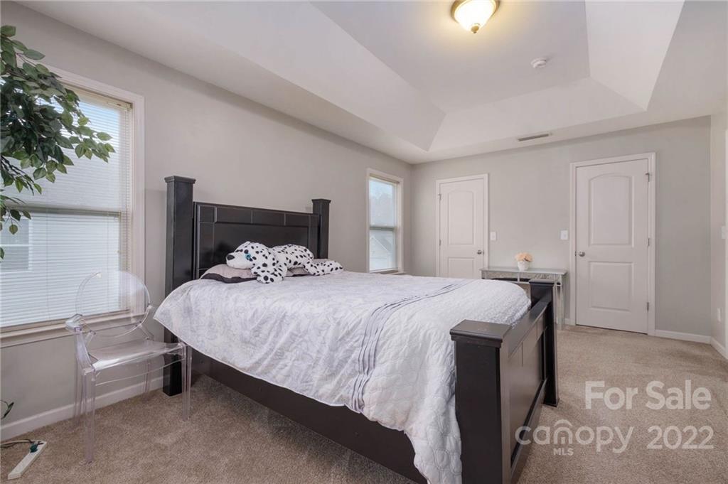 5846 Ringneck Road Charlotte, NC 28216 - Photo 21 of 28 a bedroom with a bed and a window