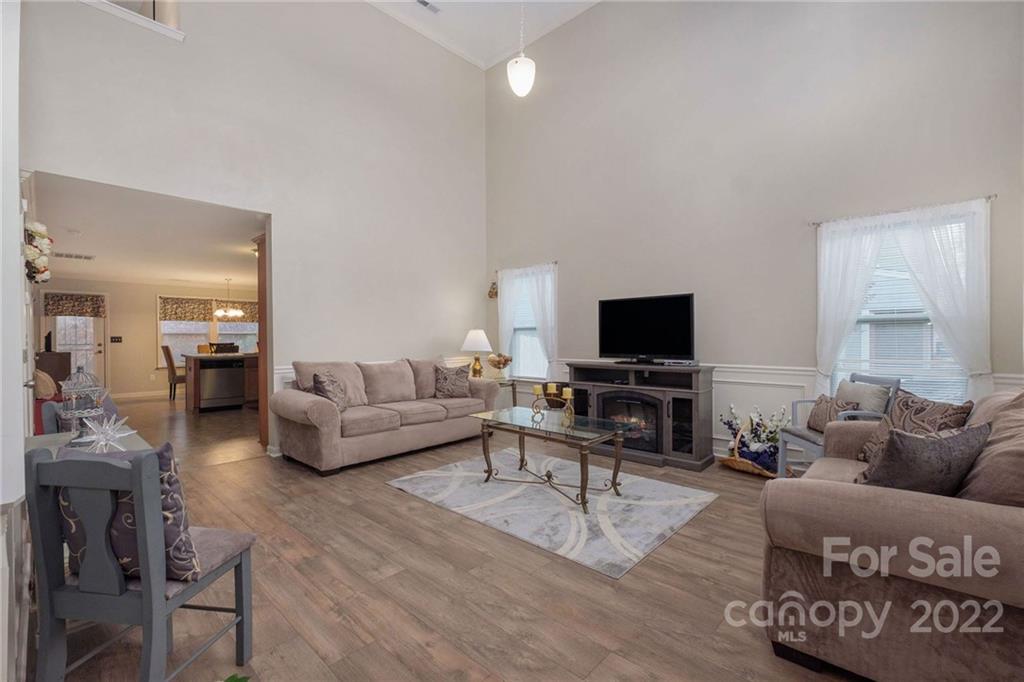 5846 Ringneck Road Charlotte, NC 28216 - Photo 4 of 28 a living room with furniture and a flat screen tv