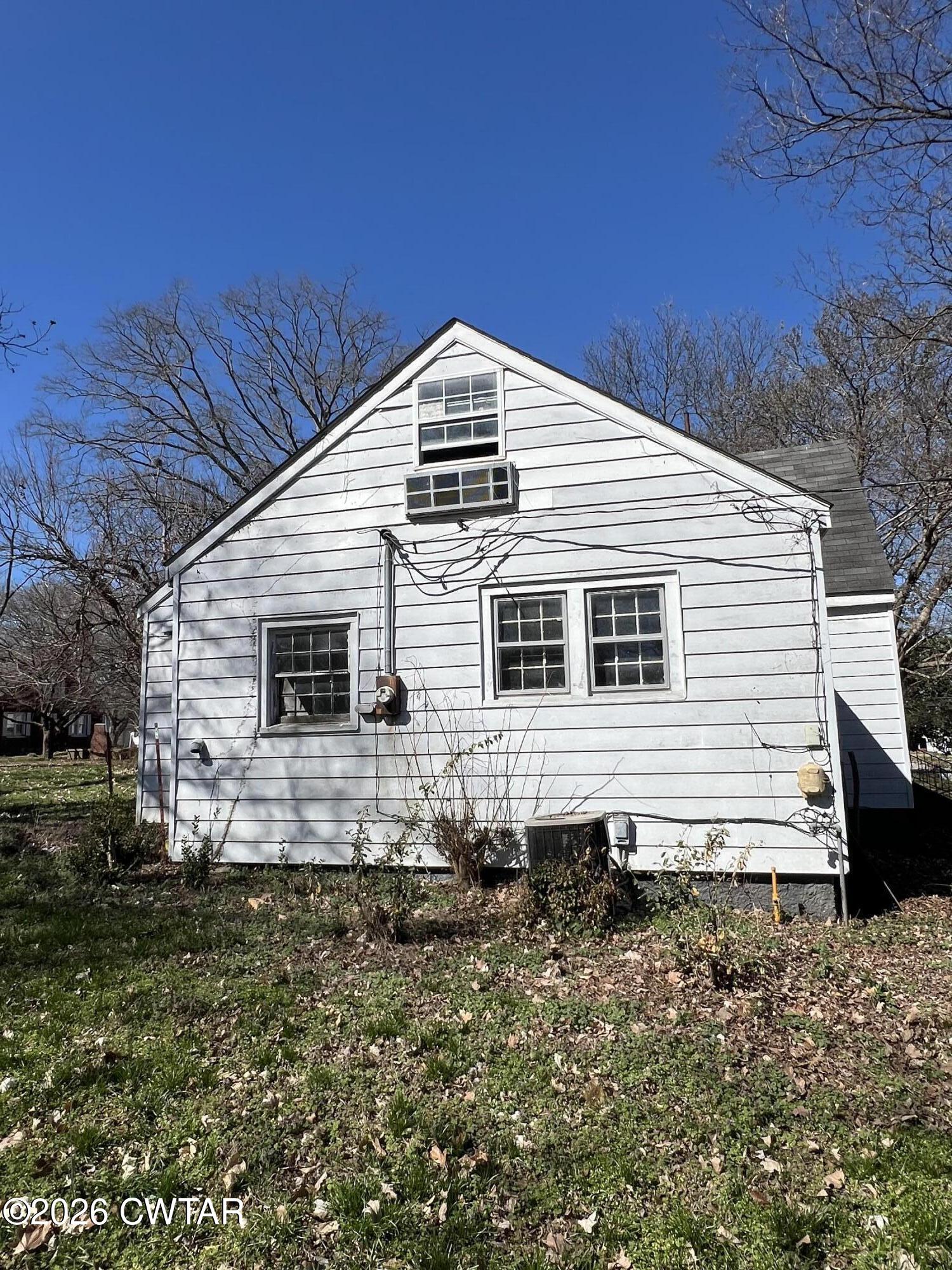 226 Madison Street Dyer, TN 38330 - Photo 5 of 8 a view of a house with a yard
