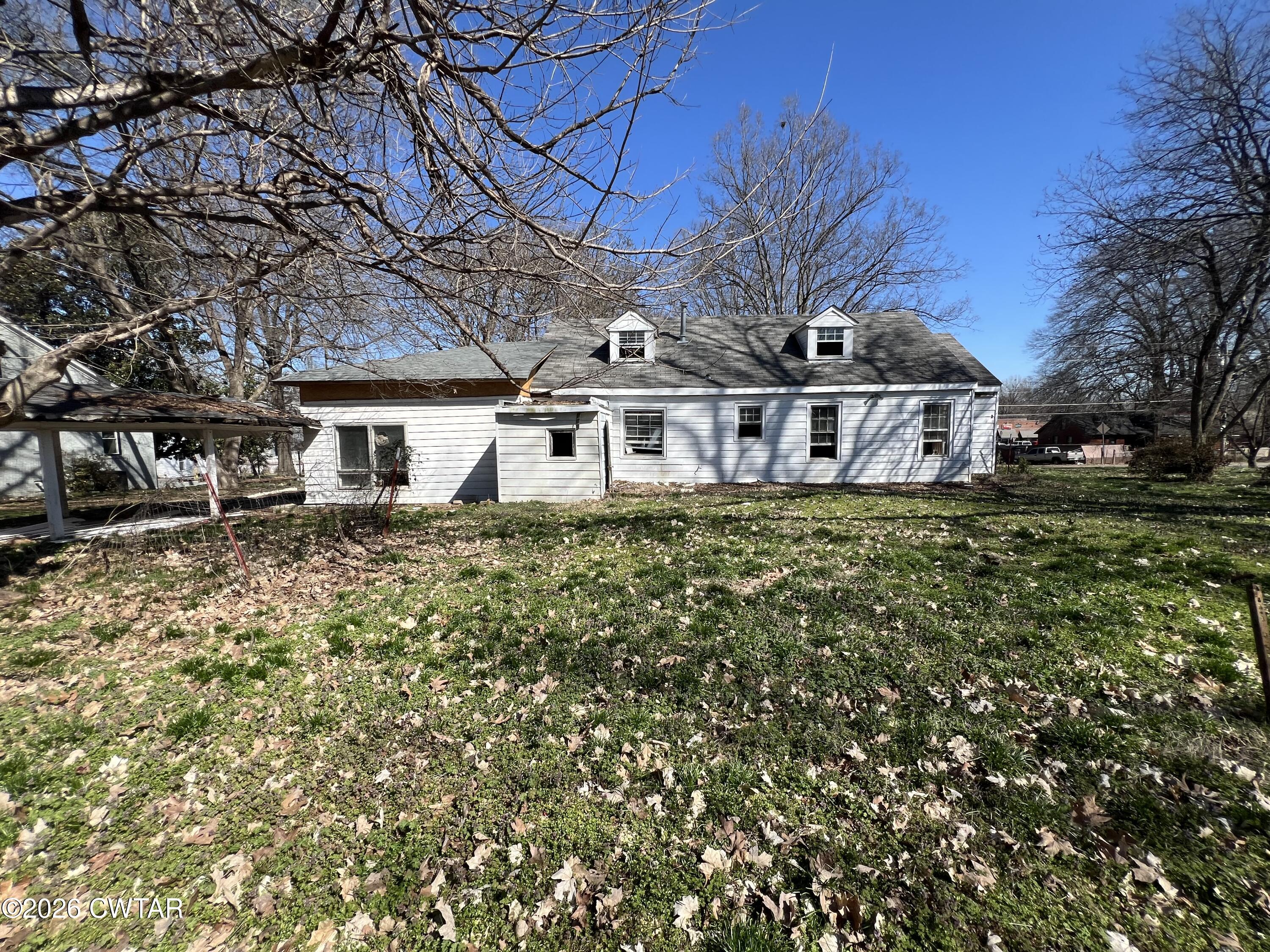 226 Madison Street Dyer, TN 38330 - Photo 6 of 8 a view of a house with a yard