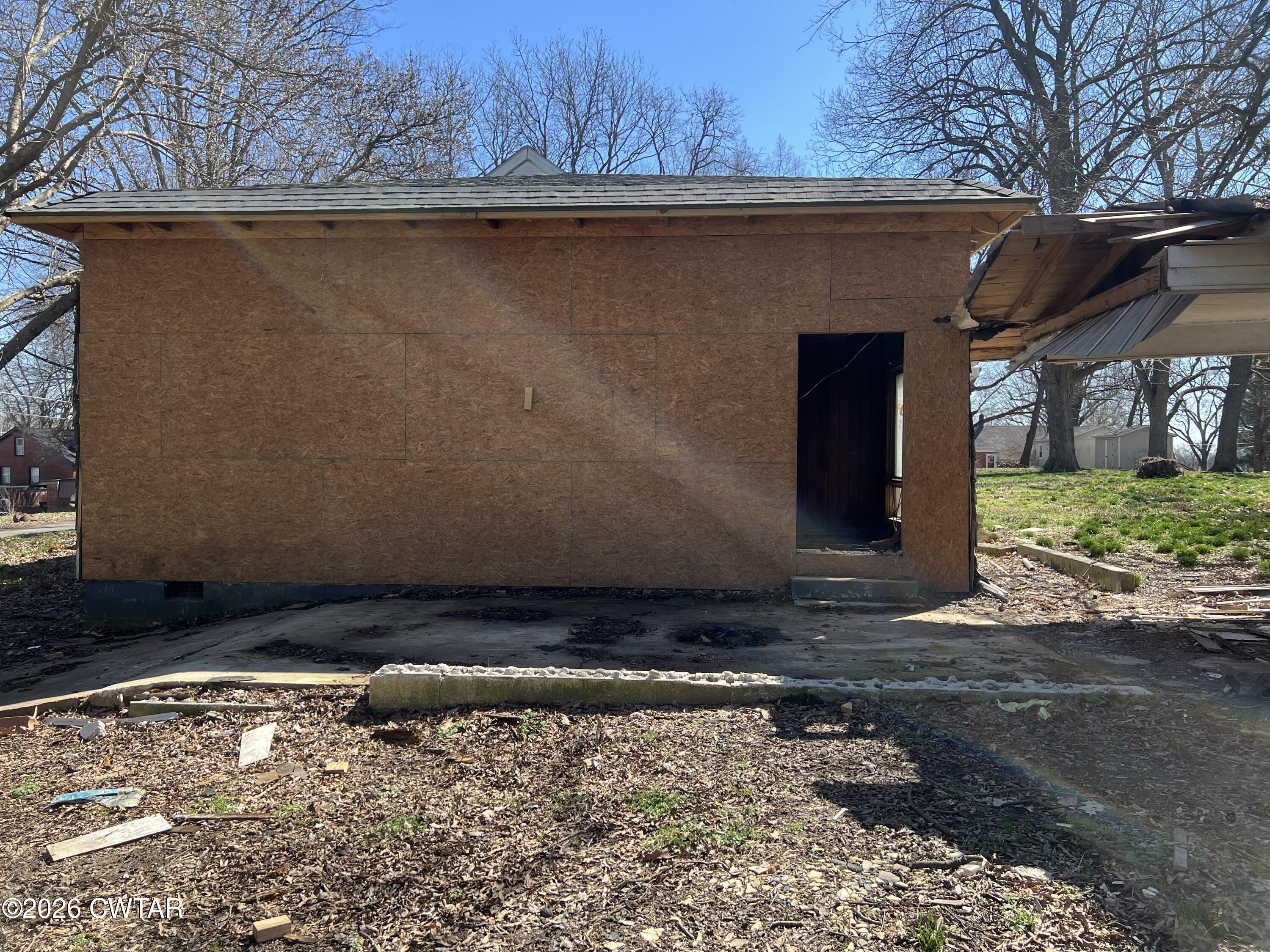 226 Madison Street Dyer, TN 38330 - Photo 7 of 8 a view of a backyard of the house