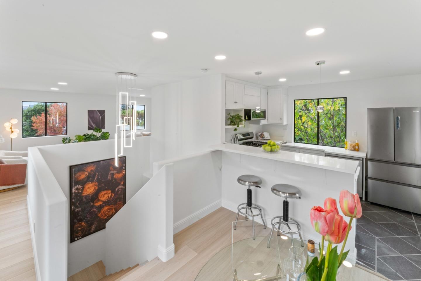 339 Monterey Street Brisbane, CA 94005 - Photo 2 of 30 a kitchen with stainless steel appliances granite countertop a refrigerator a sink a stove and a refrigerator