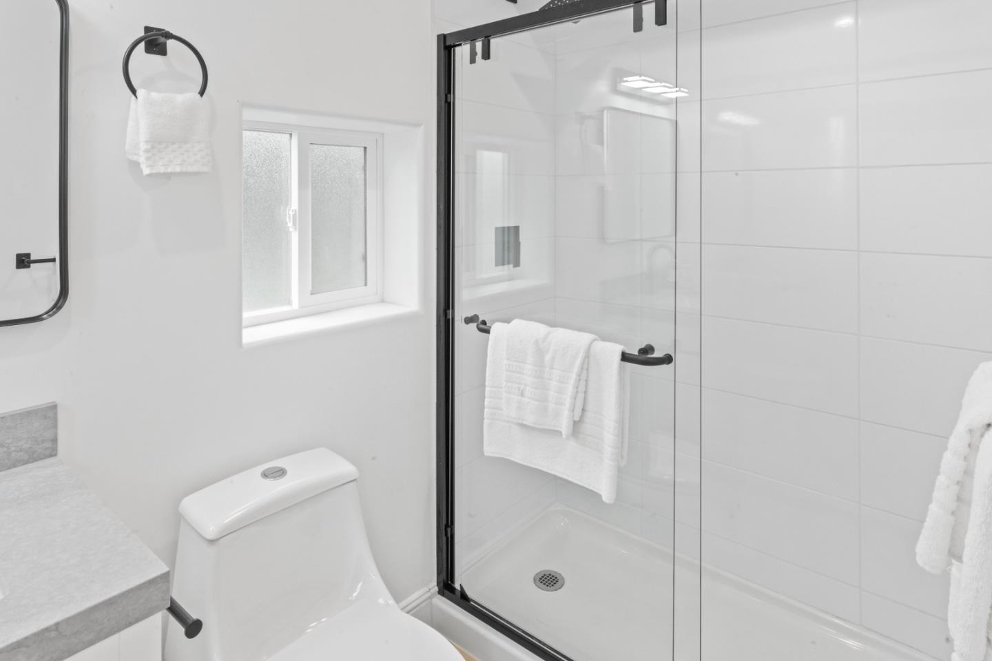 339 Monterey Street Brisbane, CA 94005 - Photo 21 of 30 a bathroom with a shower and toilet