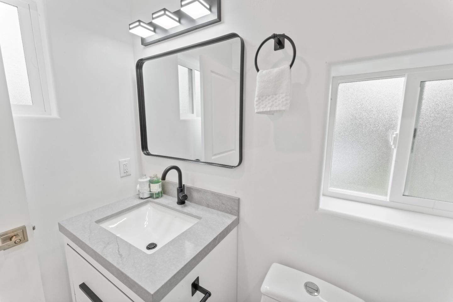 339 Monterey Street Brisbane, CA 94005 - Photo 22 of 30 a bathroom with a sink vanity and mirror