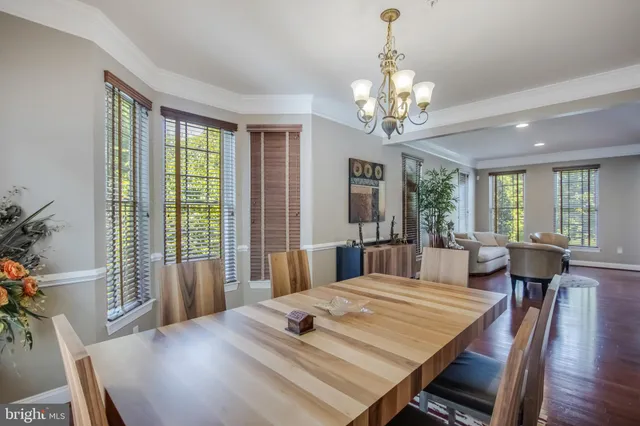 a view of a livingroom with furniture window and wooden floor