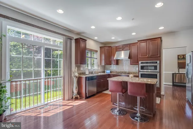 a view of an livingroom with furniture window wooden floor