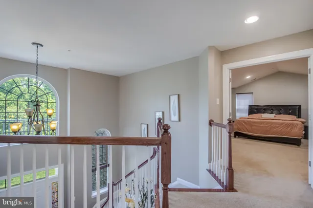 a bedroom with a bed and a table in it