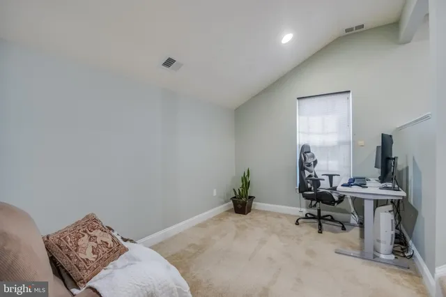 a room with furniture and flat screen tv