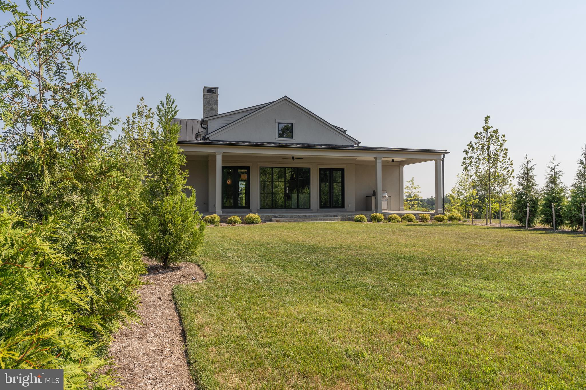 400 Martingale Ridge Drive Middleburg, VA 20117 - Photo 6 of 21 a front view of a house with garden