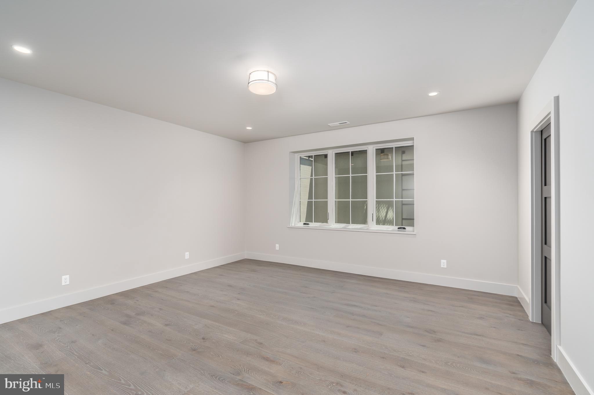400 Martingale Ridge Drive Middleburg, VA 20117 - Photo 9 of 21 an empty room with wooden floor and windows