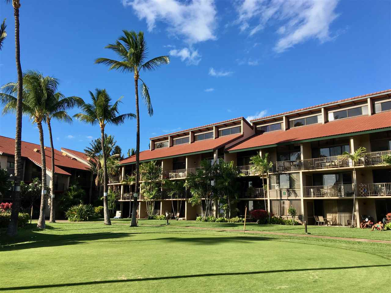 940 South Kihei Road, Unit B212 Kihei, HI 96753 - Photo 15 of 22 a view of a building and a yard in front of it