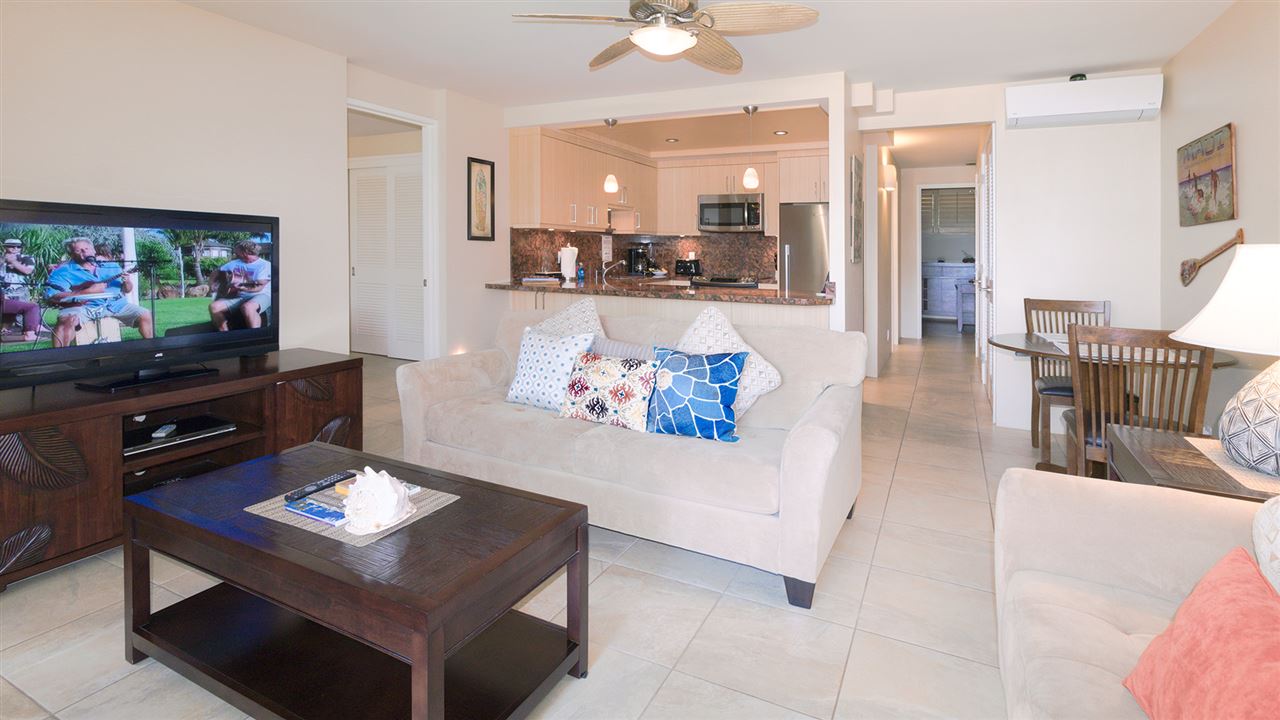 940 South Kihei Road, Unit B212 Kihei, HI 96753 - Photo 4 of 22 a living room with furniture and a flat screen tv