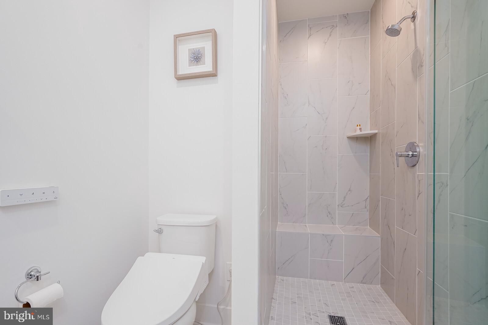 5345 Zenith Overlook Bethesda, MD 20816 - Photo 35 of 53 a white toilet sitting next to a shower