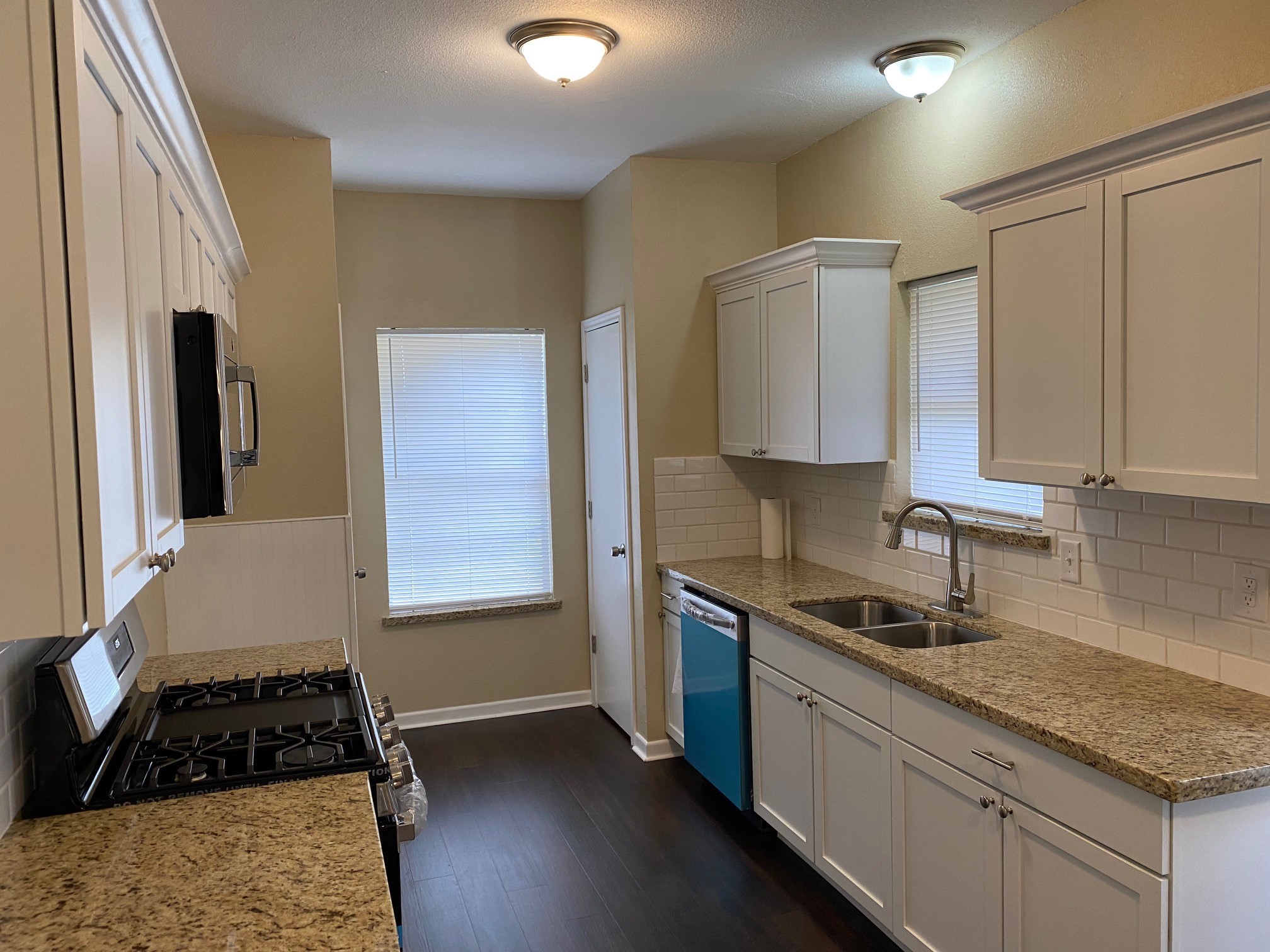 112 County Road 921 Angleton, TX 77515 - Photo 5 of 13 a kitchen with a sink stove and refrigerator