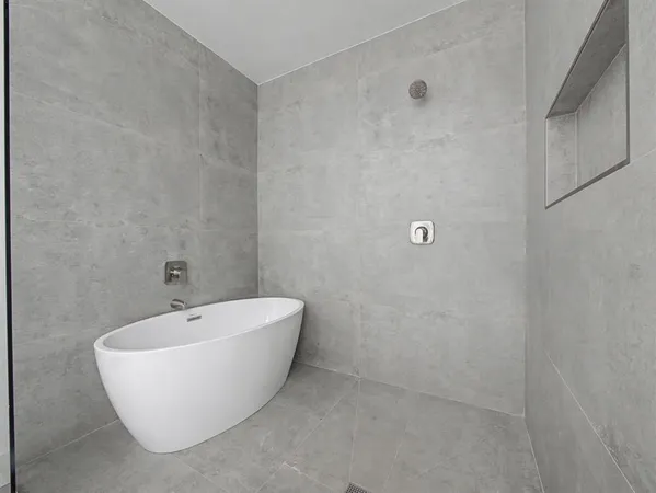 a white bath tub sitting in a bathroom