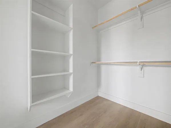 a view of an empty walk in closet