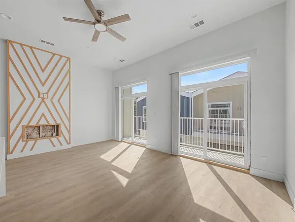 a view of an empty room with a window