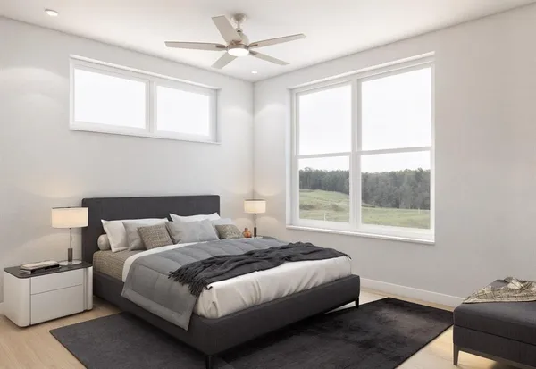 a bedroom with a bed and a window