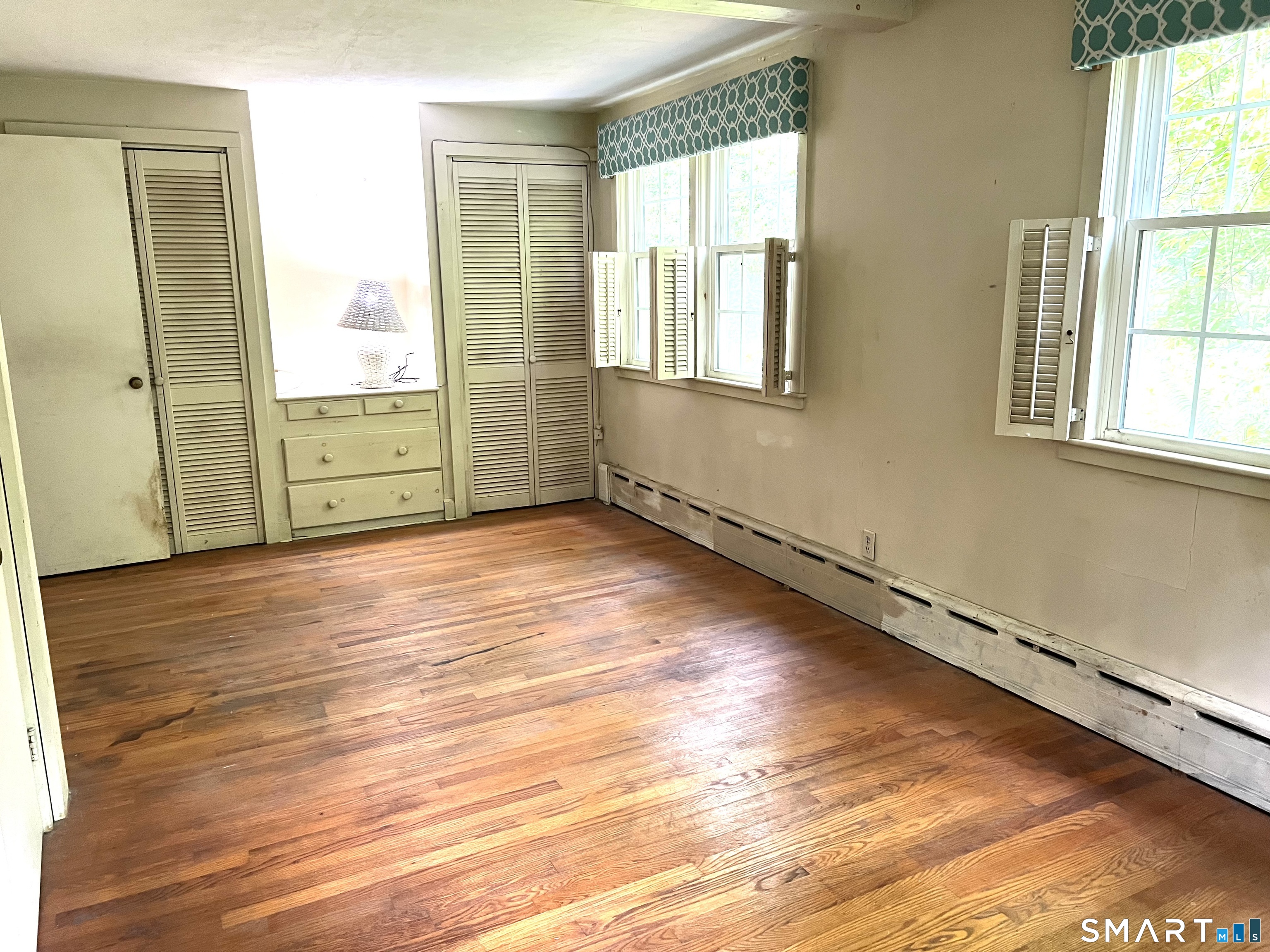 75 Black Rock Road Watertown, CT 06795 - Photo 11 of 24 an empty room with wooden floor and windows