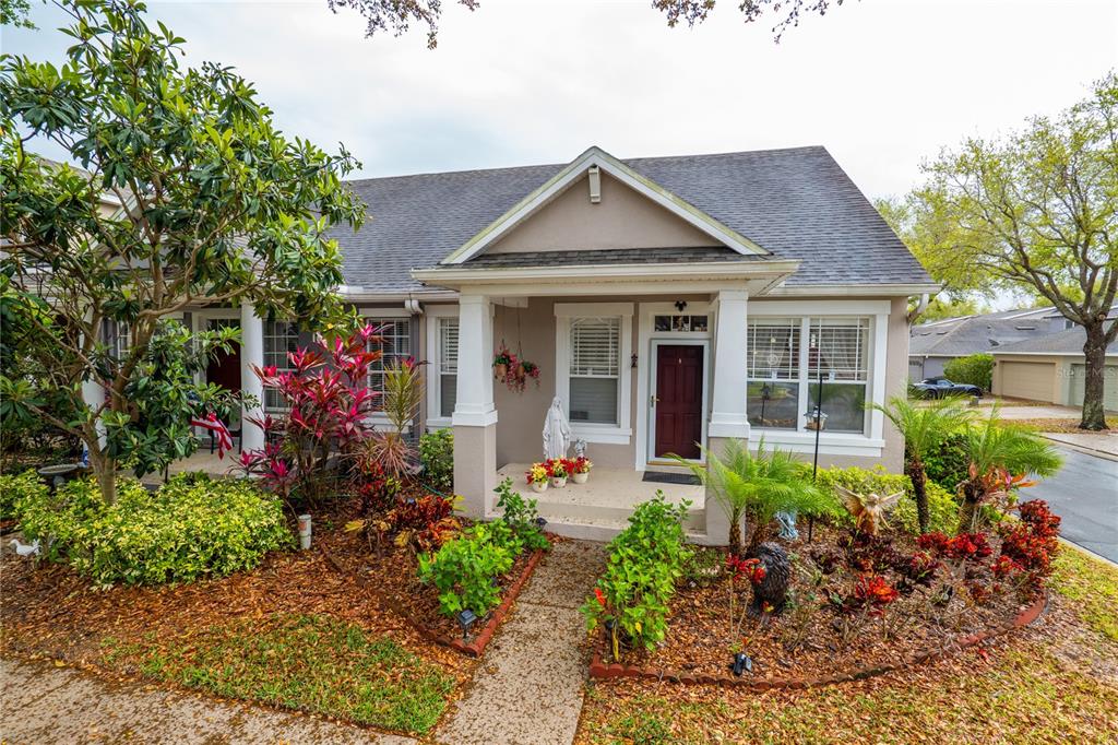a front view of a house with a garden