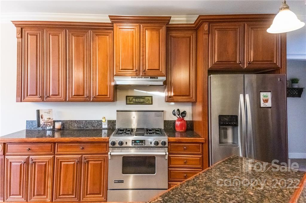 137 Birtwick Road Rockwell, NC 28138 - Photo 11 of 42 a kitchen with stainless steel appliances granite countertop a refrigerator stove and sink