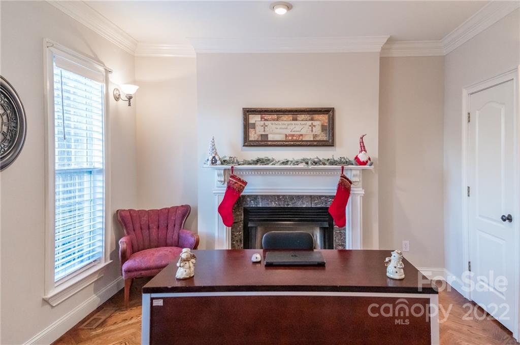 137 Birtwick Road Rockwell, NC 28138 - Photo 17 of 42 a living room with furniture a flat screen tv and a fireplace