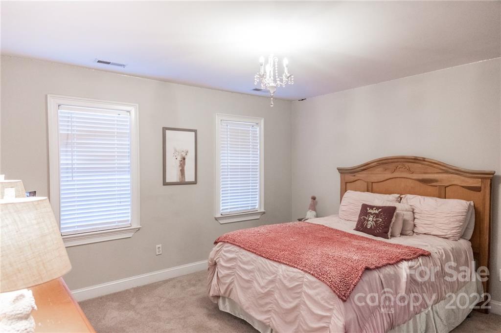 137 Birtwick Road Rockwell, NC 28138 - Photo 20 of 42 a bedroom with a bed and a window