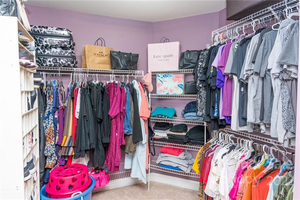 137 Birtwick Road Rockwell, NC 28138 - Photo 27 of 42 a view of walk in closet with clothes and shoes