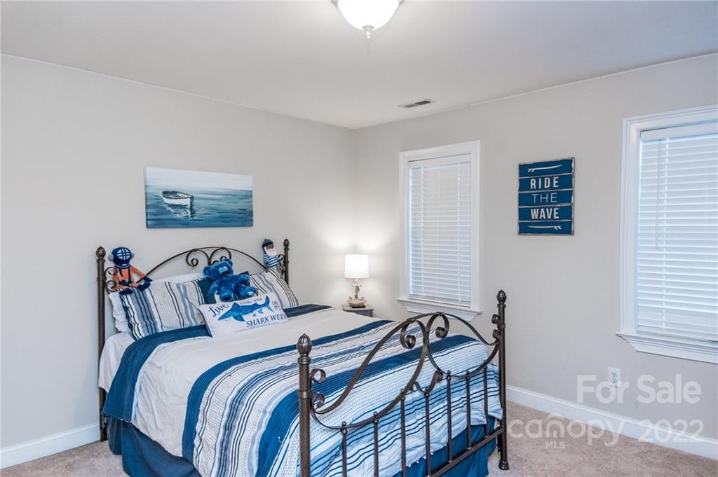 137 Birtwick Road Rockwell, NC 28138 - Photo 28 of 42 a bedroom with a bed and a window