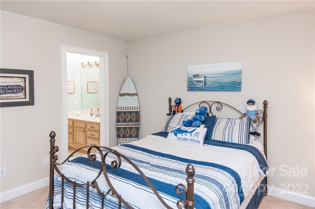 137 Birtwick Road Rockwell, NC 28138 - Photo 29 of 42 a bedroom with a bed and a table in it