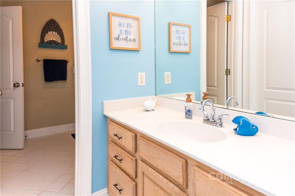 137 Birtwick Road Rockwell, NC 28138 - Photo 30 of 42 a bathroom with a sink a vanity and a mirror
