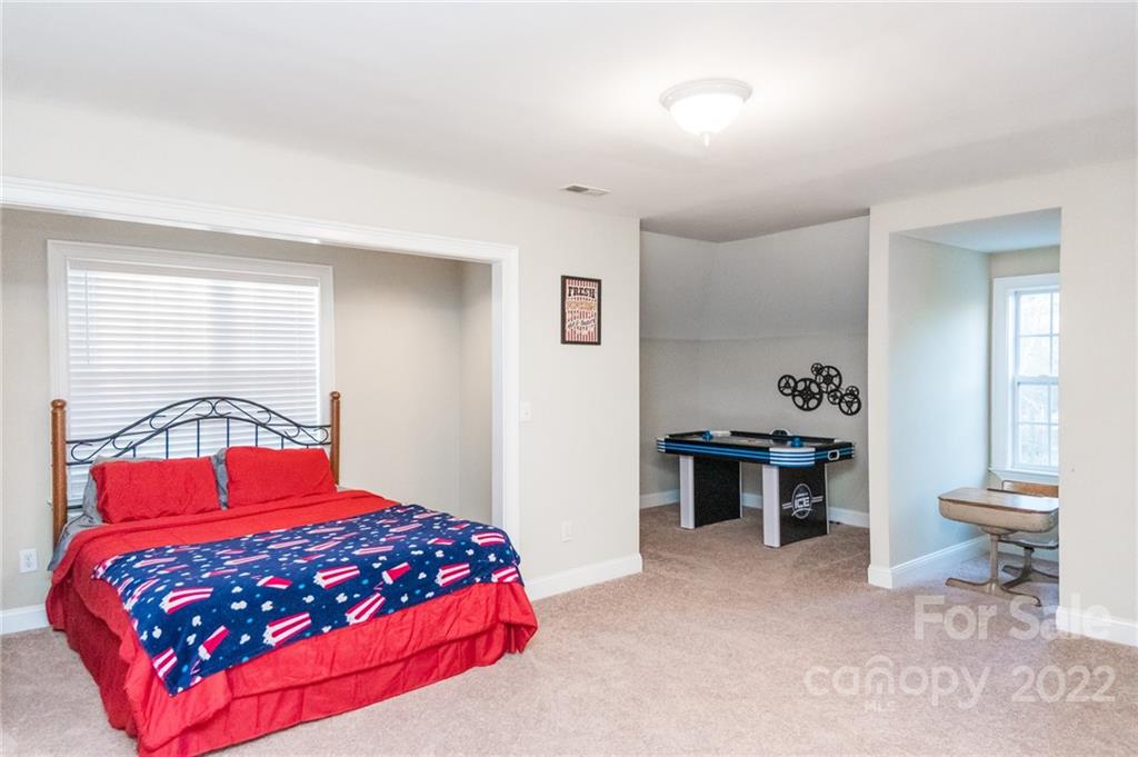 137 Birtwick Road Rockwell, NC 28138 - Photo 31 of 42 a bedroom with a large bed and a window