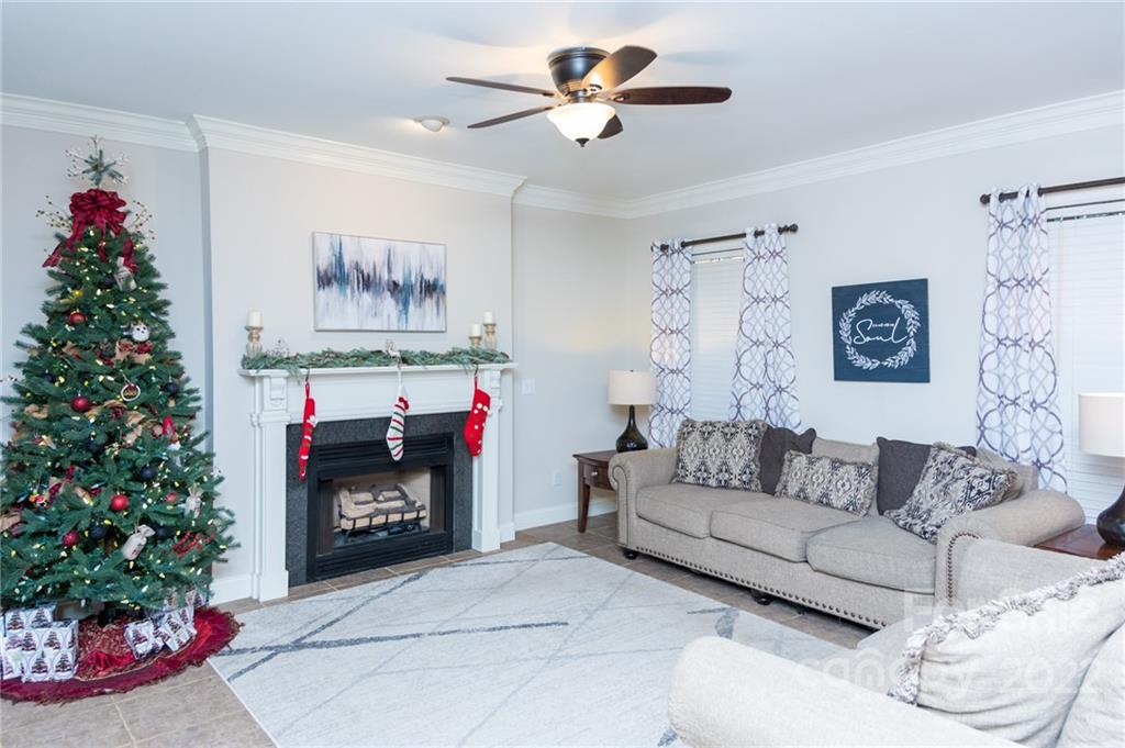 137 Birtwick Road Rockwell, NC 28138 - Photo 34 of 42 a living room with furniture a flowers and a fireplace