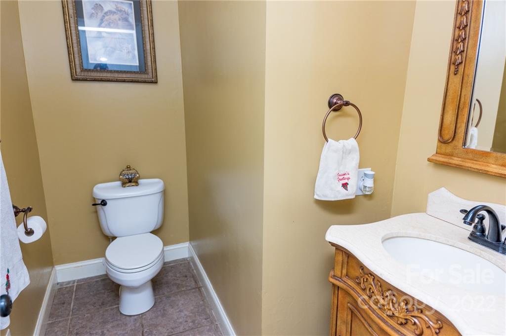 137 Birtwick Road Rockwell, NC 28138 - Photo 37 of 42 a bathroom with a toilet sink and mirror