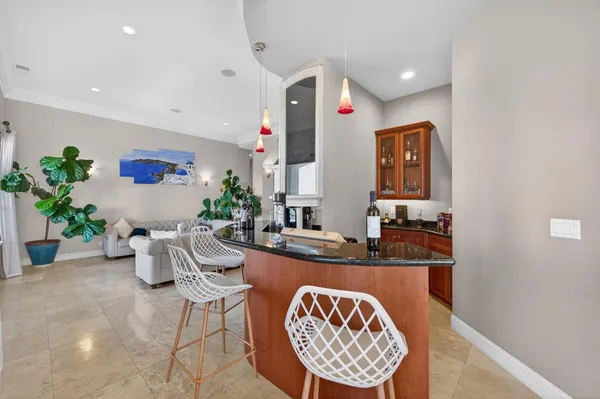 a kitchen with stainless steel appliances granite countertop a sink a stove and a refrigerator