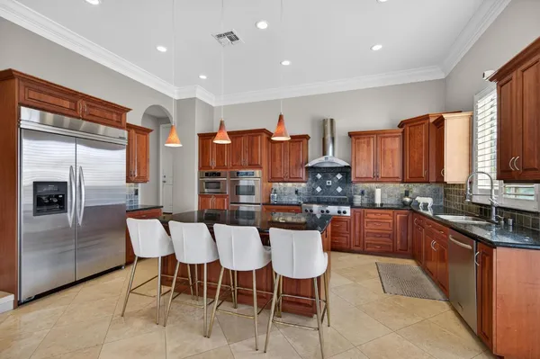 a kitchen with granite countertop lots of counter top space