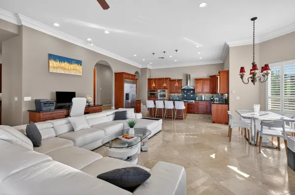 a living room with furniture fireplace and flat screen tv