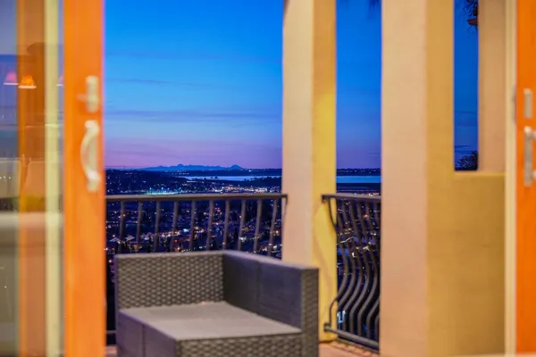 a living room with furniture and a large window