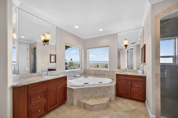 a bathroom with a granite countertop sink a toilet and a mirror