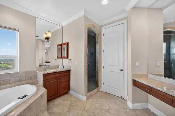 a spacious bedroom with a bed and windows