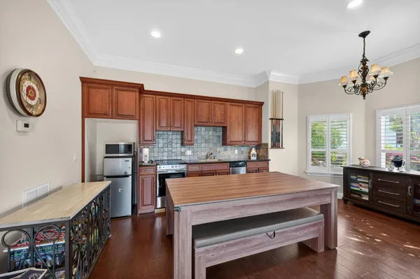 a aerial view of a house with swimming pool garden and patio