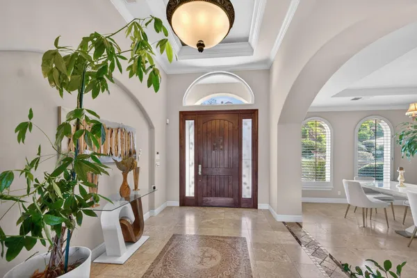 a vase of flowers sitting on a floor