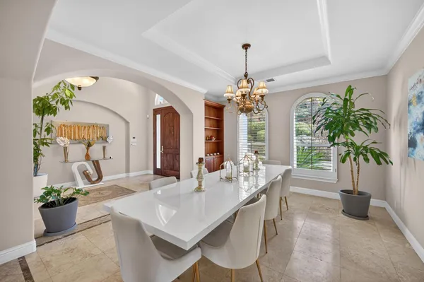 a view of a dining room with furniture window and outside view