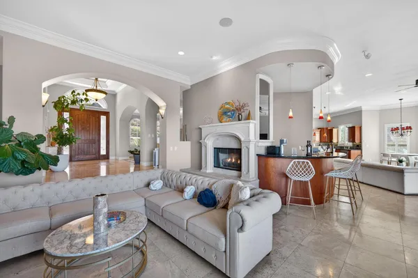 a large kitchen with a table and chairs