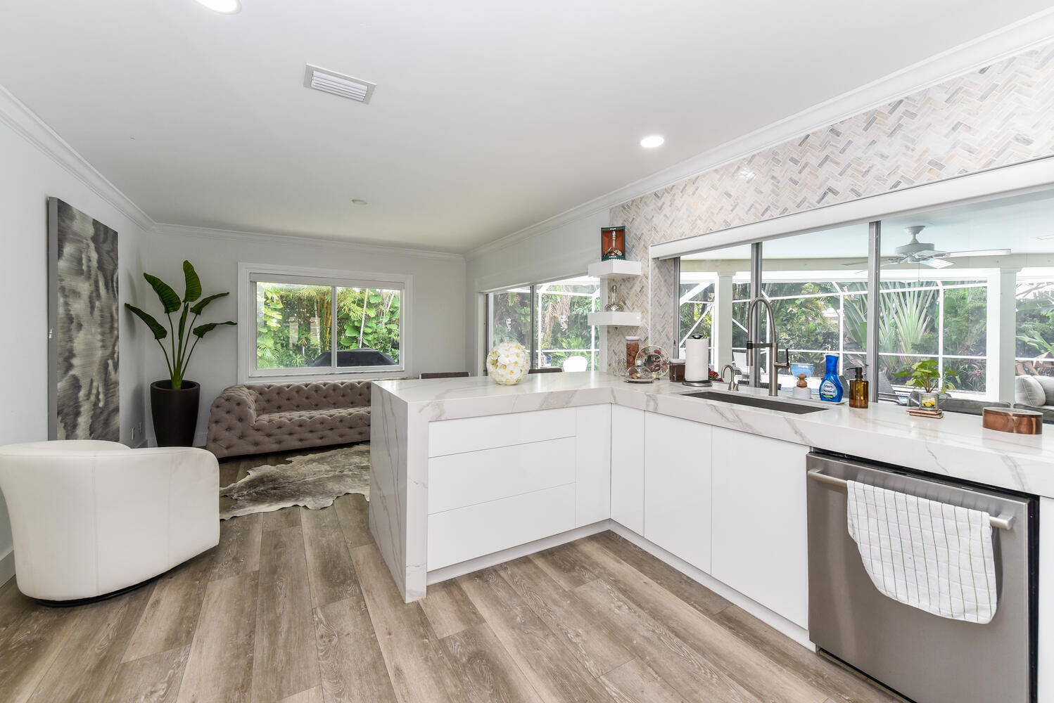 880 Hickory Terrace Boca Raton, FL 33486 - Photo 10 of 38 a kitchen with a sink and living room